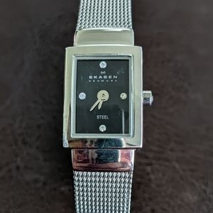 Skagen stainless steel ladies watch with black face and diamonds
